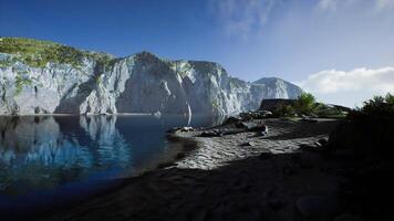 Serene Australian coastline with cliffs reflection at dawn by calm waters video