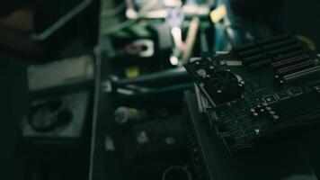 Detailed view of circuit board and electronics in a workshop setting at night video