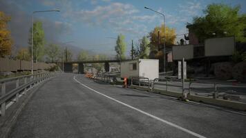 View of a winding road with construction site and trees during the day video