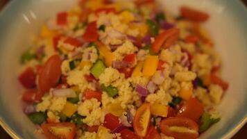 A bowl of mixed vegetables with tomatoes and peppers photo