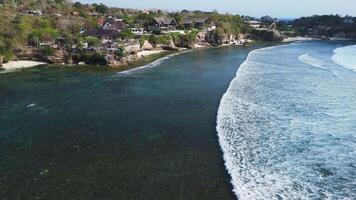 Drone view of coastline on Ceningan island with ocean and waves. video