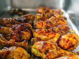 A tray of chicken wings sitting on a counter photo