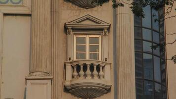 A clock on a building with a window photo