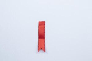 Red ribbon marker isolated on white background photo