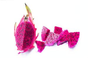 Red dragon fruit Arranged in appetizing portions Isolated on a white background. Top view. photo