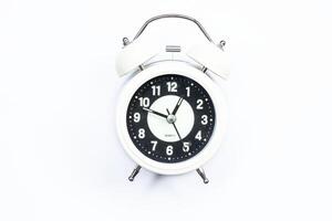 Ramadan concept alarm clock, hunger delay alarm white background top view. photo