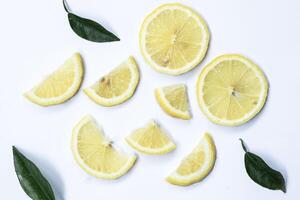 A set of sliced lemon isolated on white background. Top view. photo