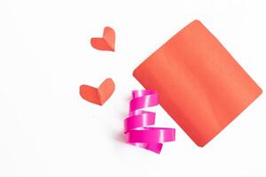 Blank red card with small heart ribbon top view with copy space photo