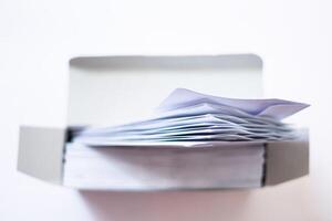 stack of Blank White Envelope Mockup with Invitation Cards photo