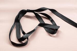Mourning ribbons on the background. Black ribbon isolated on background, photo object. clipping path.