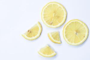 Lemon slices as pattern isolated on white background photo