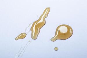 Flowing honey isolated on white background. Ideal for packaging. photo