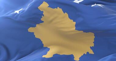 Flag of Kosovo waving at wind with blue sky in slow, loop video