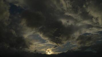 Airplane passing in cloudy sky at sunset toward the rairport runway for landing video