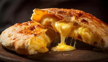 close-up of cheese-stuffed flatbread cut open with hot, gooey melted cheese stretching and oozing out, served on a rustic dark surface photo