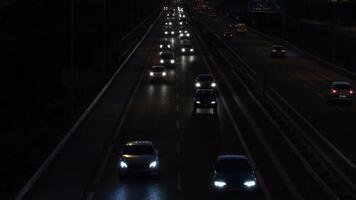 Cars crowd circulating with traffic in a highway at night video