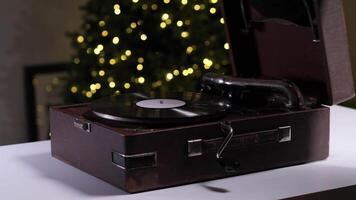 presentation of vintage gramophone. Man opens a vintage, old-fashioned, brown suitcase gramophone video