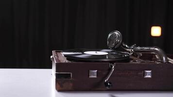 start playing vinyl record on retro record player. Retro music concept. Vinyl records video