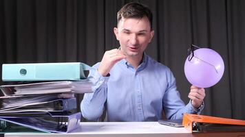 an office worker entertains himself with games instead of working video