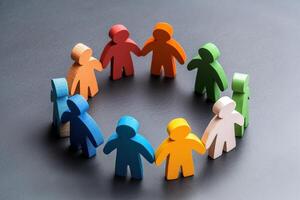 Colorful human figures in a circle symbolizing unity and community connection. photo