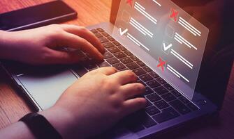 Document approval certification and checklist concept. Woman use laptop with VR checklist with approved and rejected projects. Business performance monitoring concept. photo