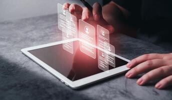 Woman use digital tablet to build a strong team at work. Human resources and management concept. photo