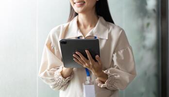 Dynamic businesswomen engaging with in a office environment optimizing work efficiency photo