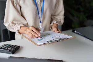 Professional Workspace with Documents and Charts on Table for Business Analysis and Planning photo