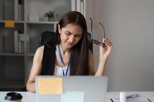 Stressed Office Workers Struggling with Workload and Deadlines in a Modern Corporate Environment photo