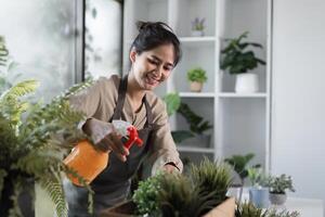 Young Woman Creating a Small Indoor Garden with Houseplants in a Modern Room for Relaxation and Green Living photo
