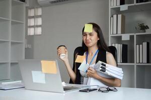 Stressed Office Worker Juggling Documents and Coffee in a Modern Workspace photo