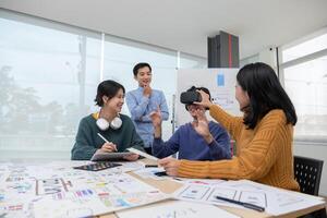 The program developer team held a brainstorming meeting to design and develop software for smart VR glasses that is in the process of updating the system. photo