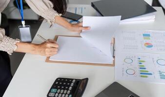 Professional Workspace with Documents and Charts on Table for Business Analysis and Planning in a Modern Office Environment photo