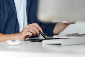 Graphic Designer Selecting Color Pairs on Computer for Creative Projects in Modern Office Environment photo