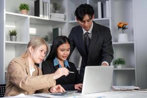 Diverse Business Team Collaborating on Project Plans in Modern Office Setting photo