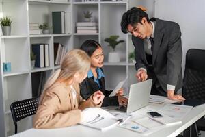 Diverse Business Team Collaborating on Project Strategy in Modern Office Environment photo