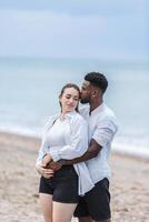 A couple enjoys a romantic walk on Zapillo beach in Almeria, Spain, embracing the sunset by the shore photo