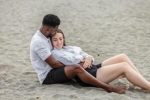 Couple enjoying a relaxing moment together on Zapillo Beach in Almeria, Spain during a sunny day by the sea photo