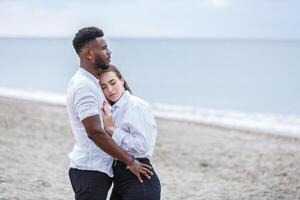 Couple enjoying a romantic moment together at Zapillo Beach in Almeria, Spain, on a serene afternoon by the sea photo