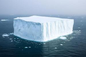 An iceberg floating in the ocean photo