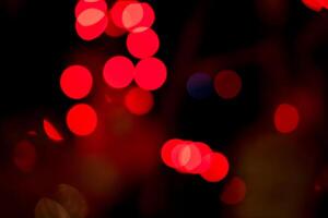 Red Christmas garland blurred and defocused with bokeh photo