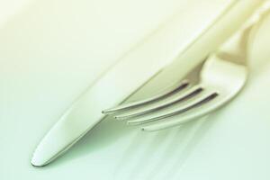 Fork and knife on a white background photo