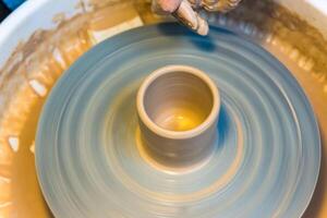 Pottering - creating a clay cup in process photo