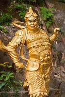 Golden statue in The monastery in Hong Kong photo