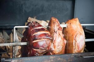 roasted pig knuckle on the spit photo