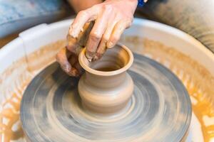 Pottering - creating a clay cup in process photo