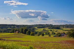 Rural landscape with a Farm and a fileld photo