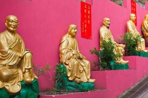 Golden statues in The monastery in Hong Kong photo
