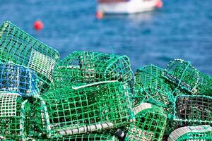 Lobster and Crab traps stack in a port photo