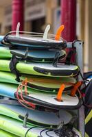 Surf boards in a stack photo